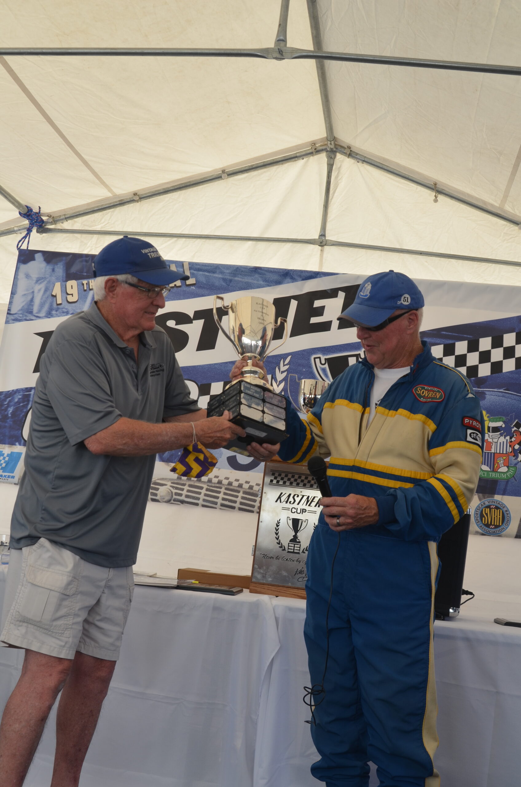 Jeff Quick receiving the Kastner Cup from Grand Marshal Joe Alexander